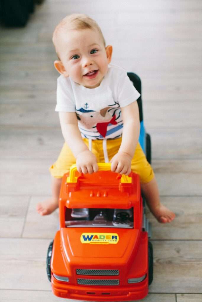kid_riding_toy_truck